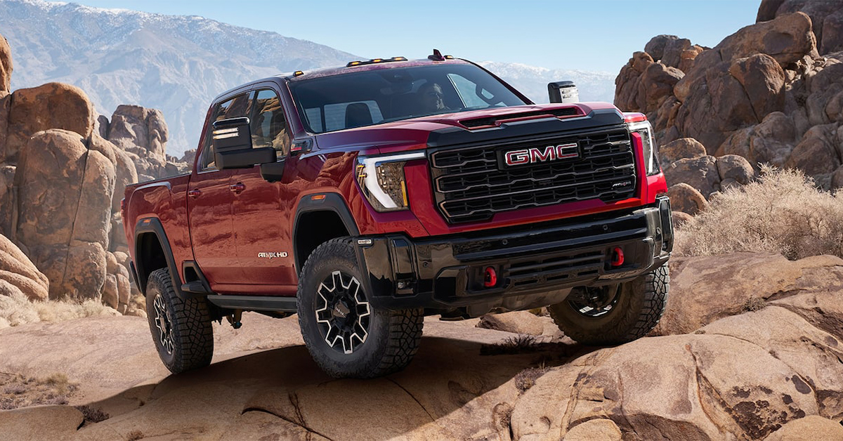 2025 GMC SIERRA 2500 HD climbing over rocks in the desert