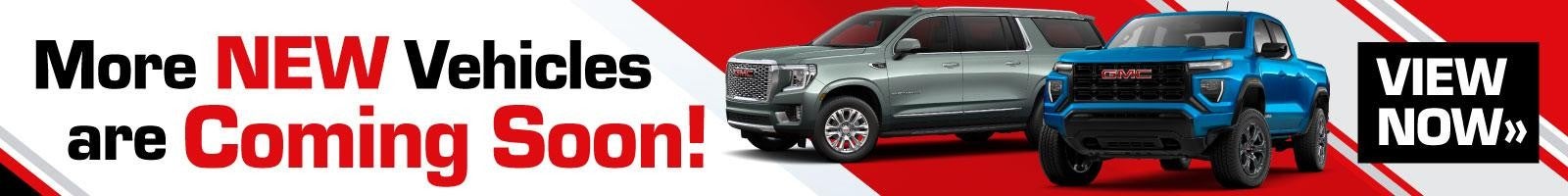 Two GMC vehicles parked side by side with a bold text overlay: 'More new vehicles are coming soon.'